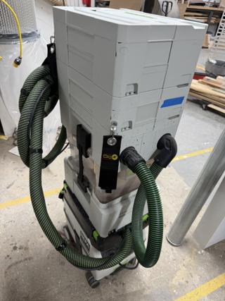 The back of the same stack, showing the eyelet and empty strap hanging from the lowest systainer while the hose is connected to the extractor and in use