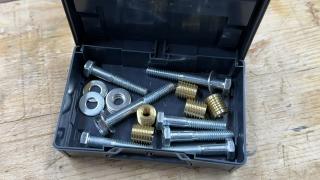 An open anthracite Systainer³ XXS holding hex bolts, washers, nuts and brass threaded inserts for a tool cabinet build