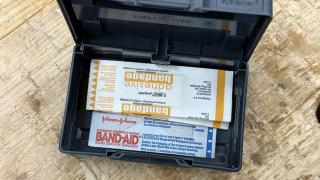 Adhesive bandages and a Band-Aid packet inside an open anthracite Systainer³ XXS