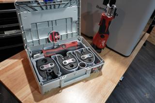 Milwaukee M12 press tool and three press jaws in a gray 3D printed 10-Spot Tools insert, inside an open Light Grey Systainer³ M 112 on a workbench